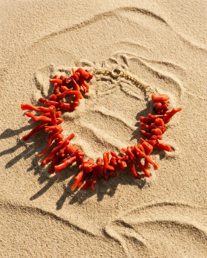 Coral necklace on sand
